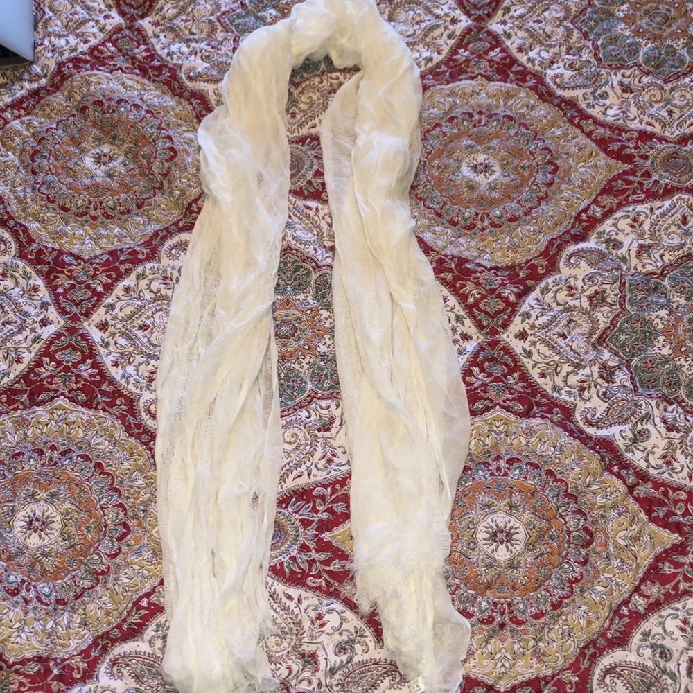 cream colored scarf frayed ends